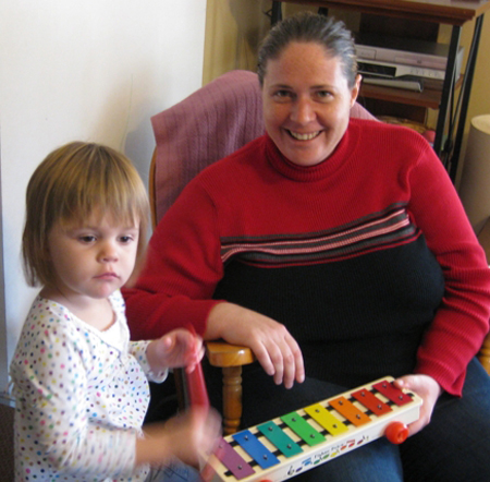 girl makes music with mom
